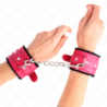 KINK - SUJECIONES DE MUÑECA FORRADAS CON PIEL PREMIUM NEGRAS CON CINTURÓN ROSA FRAMBUESA AJUSTABLE 17-29 CM X 6 CM